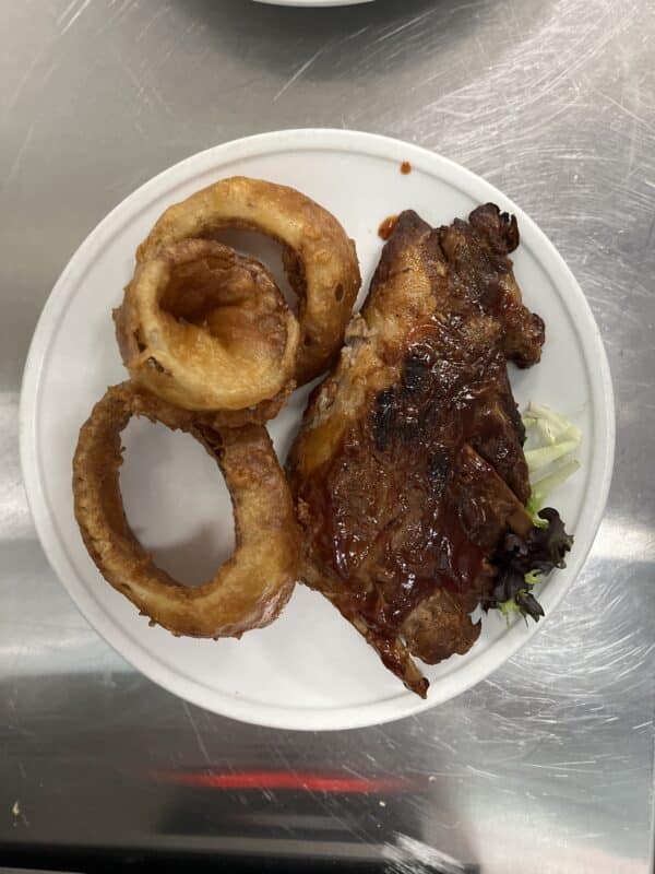 1/2 rack bar-b-q ribs on Holmes Beach w onion rings hurricane hanks
