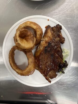 1/2 rack bar-b-q ribs on Holmes Beach w onion rings hurricane hanks